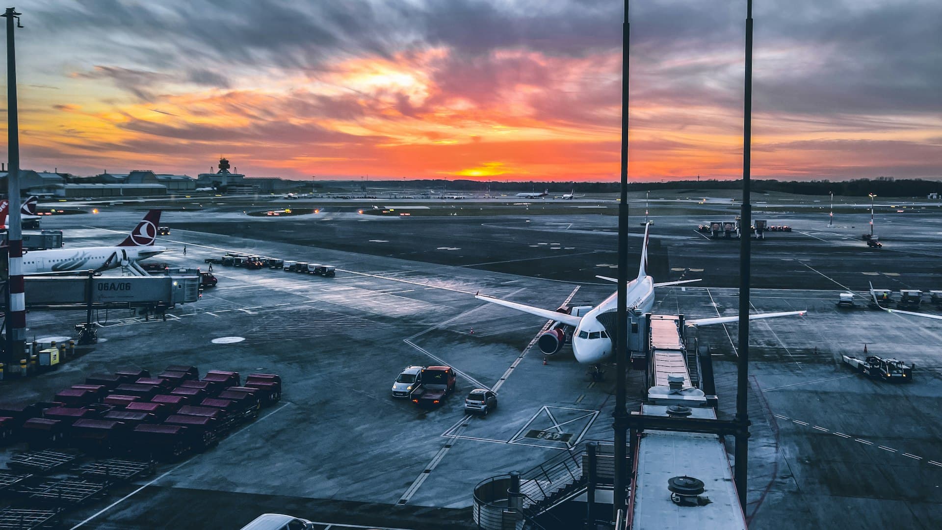 Aircraft on the runway at Milan Malpensa Airport at sunset