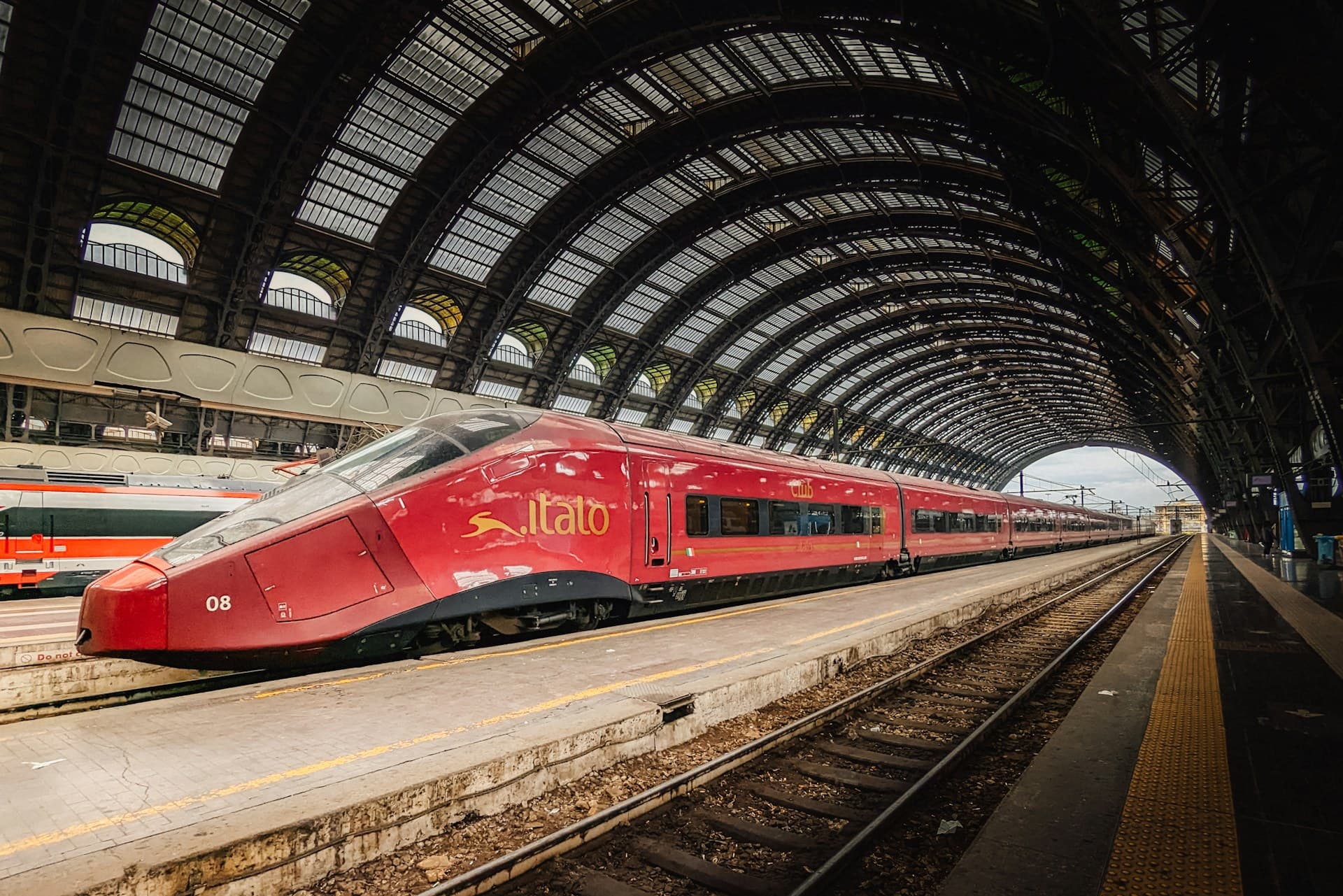 High-speed train under the arched roof of Milano Centrale station