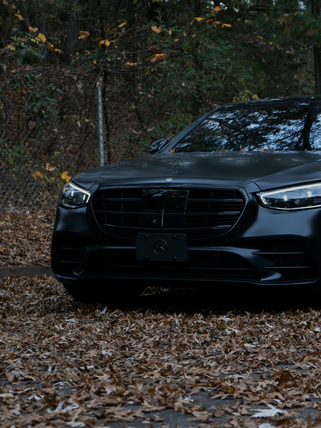 Black Mercedes-Benz S-Class executive saloon at dusk